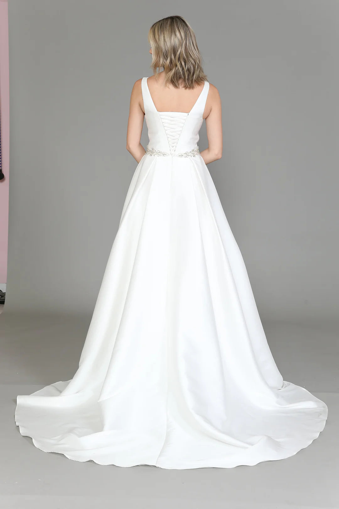 White long sleeveless satin wedding dress