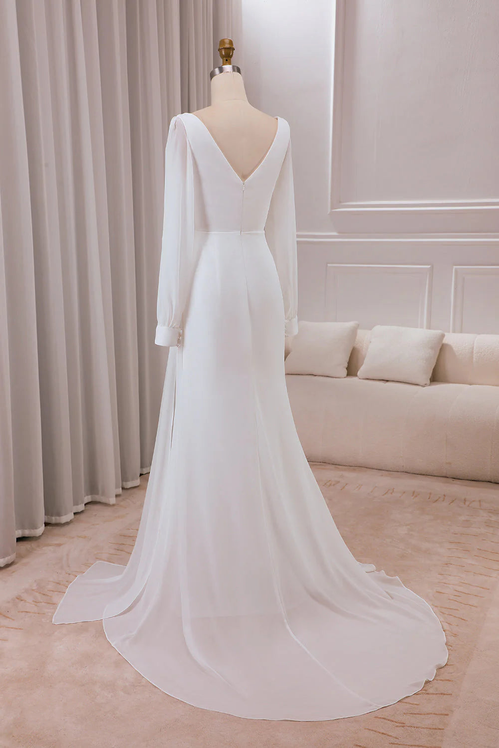 Ivory V-neck long sleeved A-line chiffon and floor length wedding dress