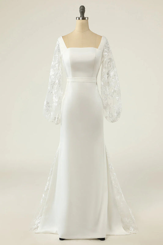 White fishtail long sleeved and floor length backless wedding dress