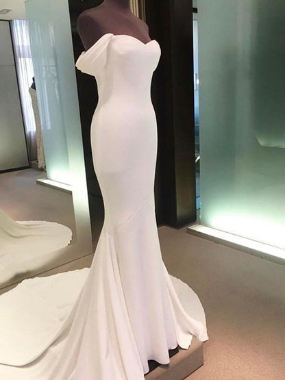 Minimalist tight fitting off the shoulder short sleeved and floor length off the back wedding dress