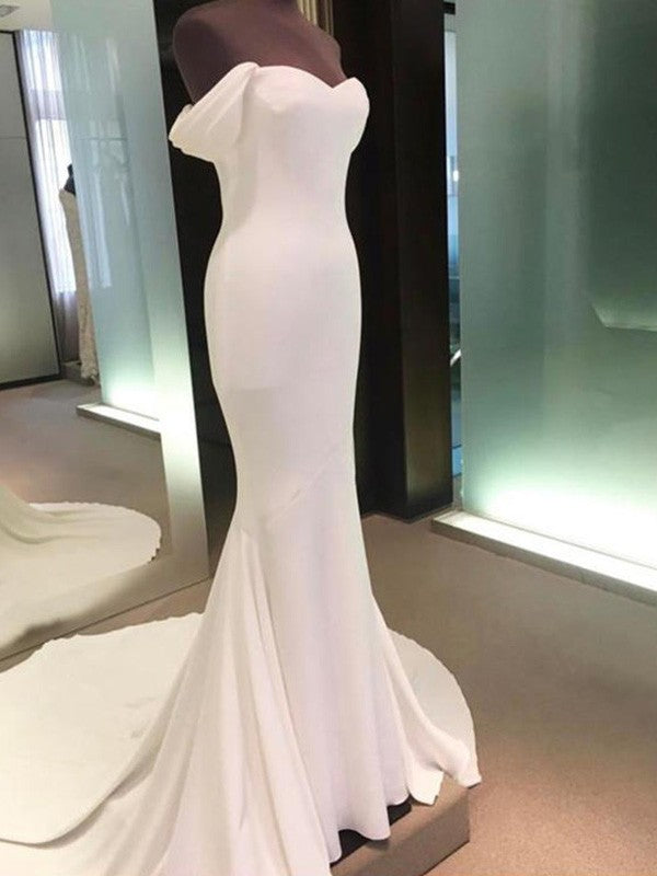 Minimalist tight fitting off the shoulder short sleeved and floor length off the back wedding dress