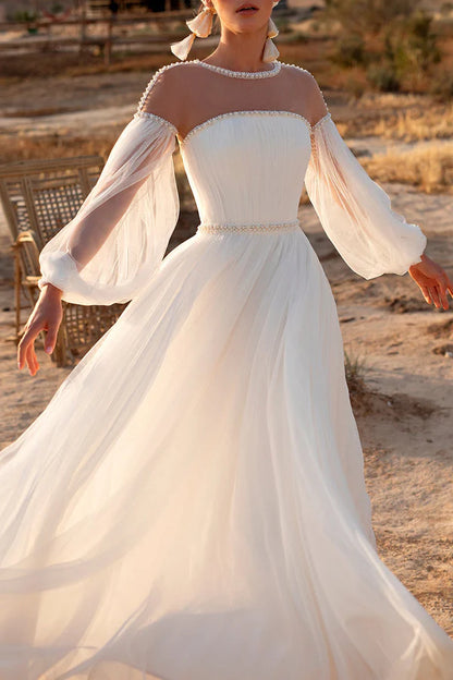 A-line illusion neckline pearl long sleeved Bohemian wedding dress